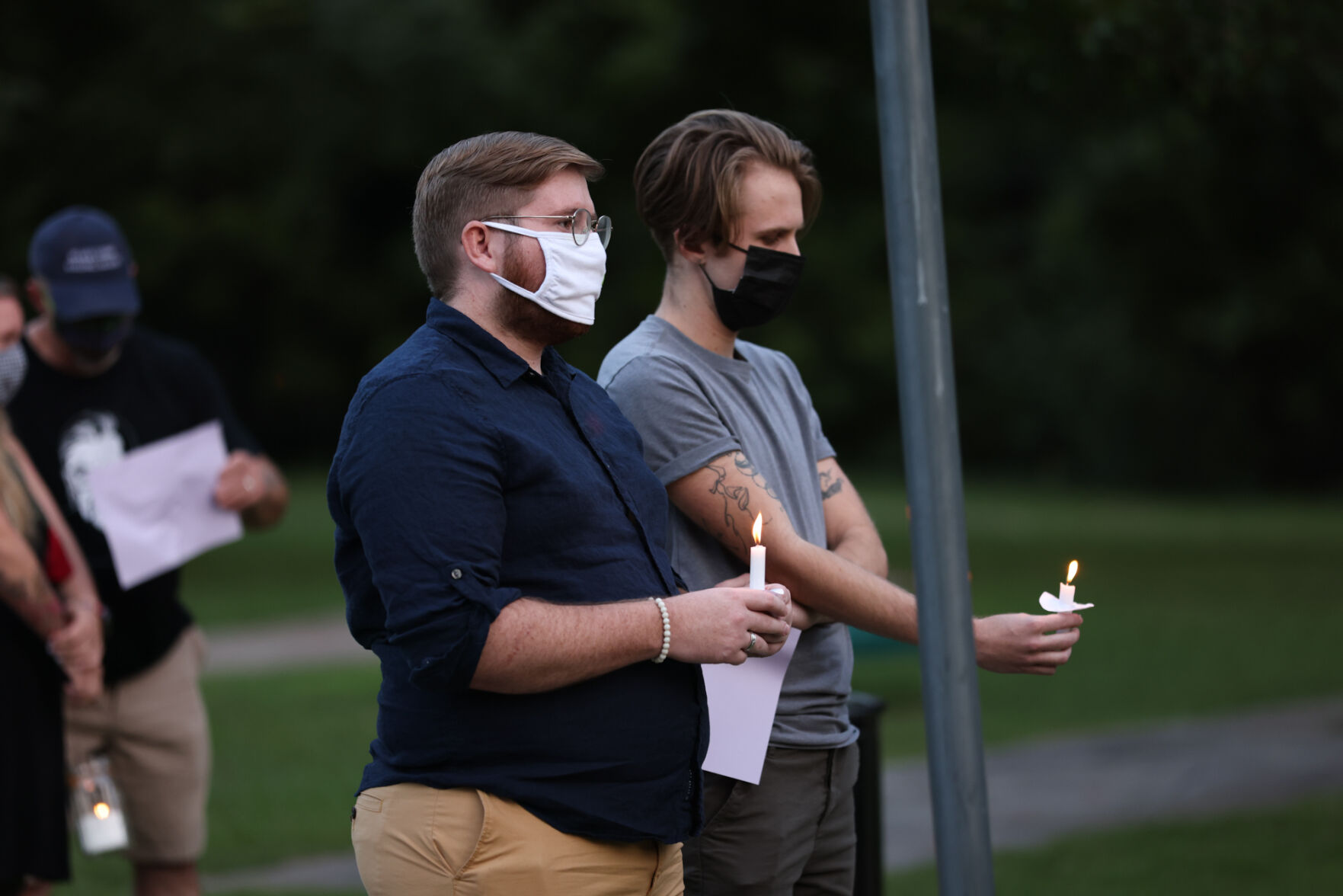 Men Holding Candles